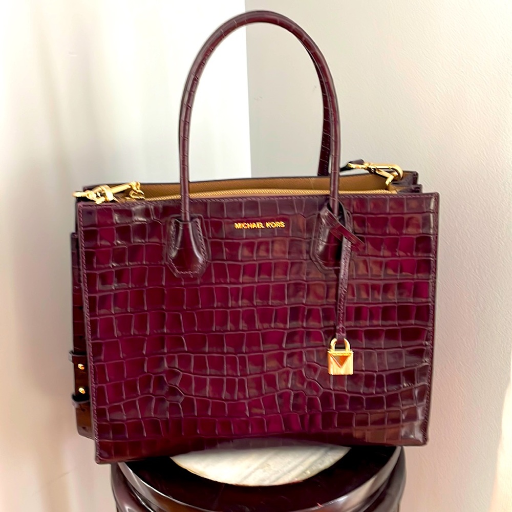 Michael Kors medium bag. Good work and travel bag that can fit your iPad.